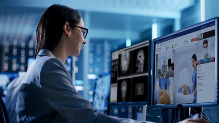A person looking at a computer screen