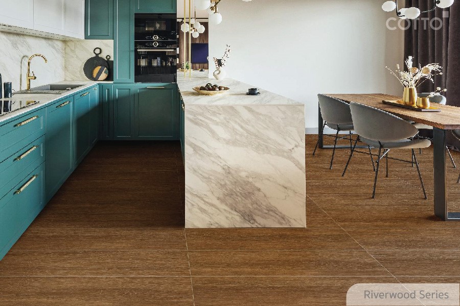 A kitchen with a marble islandDescription automatically generated