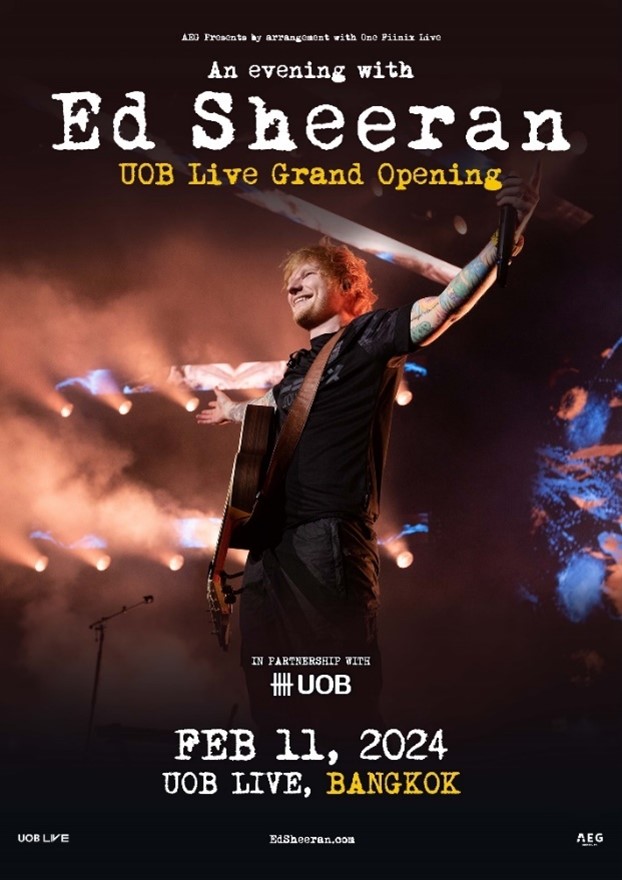 A person with a guitar on stageDescription automatically generated